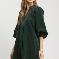 Hunter green corduroy V-neck shift dress with puff sleeves and relaxed fit