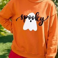 Orange mock neck sweatshirt with ghost graphic and black script print