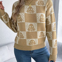 Ghost-pattern checkered round-neck sweater in tan and cream, front view.