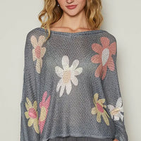 Charcoal dropped-shoulder knit top with long sleeves and multicolor floral print