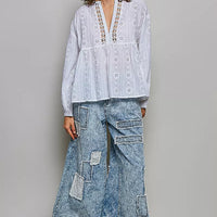 Off-white cotton eyelet blouse with V-neck and long sleeves, relaxed fit