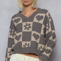 Women’s V-neck heart checkered sweater in gray with beige heart and flower squares.