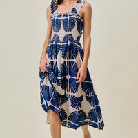 Navy abstract print tiered midi dress with smocked bodice and scalloped ruffle straps