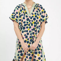 Polka dot tunic dress with V-neck and short sleeves, honey/green with pink accents