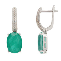Silver hinged drop earrings with emerald-green oval stone and pave accents