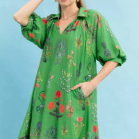 Green floral mini dress with V-neck and short puff sleeves, loose flowy fit