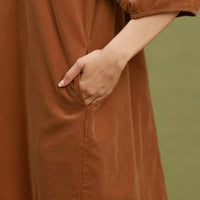Camel brown corduroy shift dress close-up of front pocket and seam details