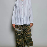 Ivory lightweight ruffle-trim woven shirt with round neck, button front, long sleeves