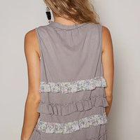 Grey sleeveless cardigan with tiered ruffles and floral hem trim