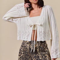 Off-white knit cardigan, open front with bow tie and loose long sleeves