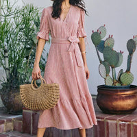 Red and white striped wrap midi dress with belted waist and ruffled tiered skirt