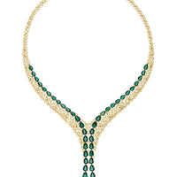Gold-plated statement necklace with oval emerald-green stones and dangling drops