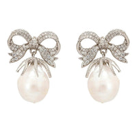 Silver pearl drop earrings with bow ribbon motif, crystal bow tops, and pearl dangle
