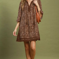 Brown geometric print V-neck tunic dress with tassel tie and above-knee length