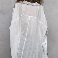 Ivory embroidered floral button-front shirt, back view with high-low hem