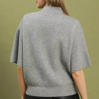 Grey knit sweater top with mock neck and short sleeves, back view