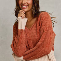 Rust chenille V-neck cropped sweater with cream contrast hem and cuffs