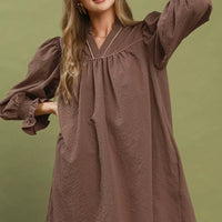 Chocolate textured mini dress with puff sleeves and gathered neckline
