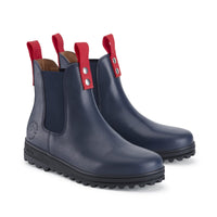 Pair of navy leather Chelsea boots with red pull tabs and lugged soles