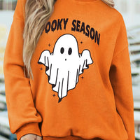 Orange mock neck sweatshirt with 'Spooky Season' ghost graphic, long sleeves