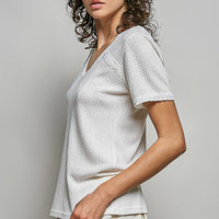 Off-white textured V-neck short-sleeve t-shirt, side profile