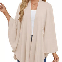 Ivory shawl cape with open front drape and loose sleeves, tied at the waist