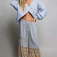 Heather gray wrap-style V-neck sweatshirt with cropped raw hem and long billowy sleeves