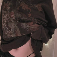 Black long sleeve t-shirt with ornate skull and floral graphic on front