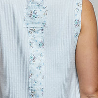 Powder blue back panel of floral print ribbed tank with vertical stitched design