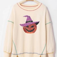 Ivory sequin pumpkin sweatshirt with striped contrast trim and relaxed crew neck