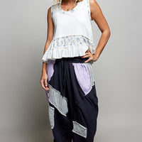 Off-white ribbed tank top with floral band and double ruffle hem