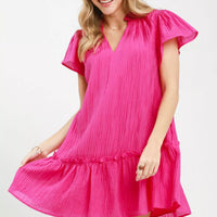 Fuchsia textured mini dress with V-neck, cap sleeves, and ruffle hem