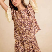 Leopard print ruffled top with eyelet lace cuffs and matching shorts