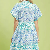 Blue floral tiered mini dress with flutter sleeves, back view
