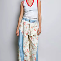 Off-white ribbed V-neck sleeveless tank with red contrast trim
