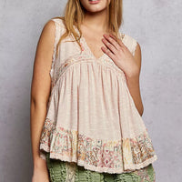 Pale pink sleeveless peplum top with lace V-neck and floral ruffle bottom