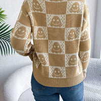 Back view of ghost-pattern checkered round-neck sweater in tan and cream.