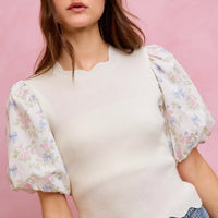 White knit sweater top with puff floral contrast sleeves and scalloped hem