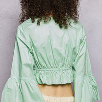 Mint floral embroidered cropped blouse back view with gathered ruffle waist
