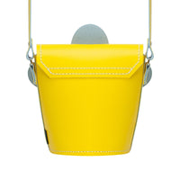 Pastel yellow leather barrel bag with top handle and stitched bucket shape