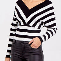 Black and white striped V-neck knitted jumper with long sleeves
