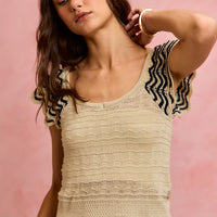Oatmeal wavy knit top with black zigzag flutter sleeves and scoop neck