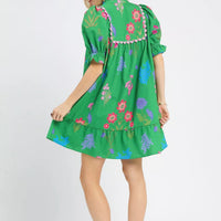 Green floral V-neck dress with puff sleeves and full skirt, back view