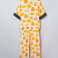Laid-out back view of pumpkin print lounge pajama set with polka-dot-trim collar and cuffs