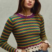 Striped cropped knit top with crochet edge hem and long sleeves in purple, green, and gold