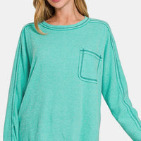 Turquoise brushed ribbed knit top, crew neck, long sleeves, contrast-stitched pocket