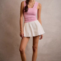 White denim bubble skort, elastic smocked waistband with flared A-line hem