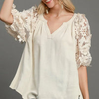 Plus size oatmeal french terry top with V-neck and 3D floral lace puff sleeves