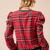 Red plaid top with exaggerated shoulders and green hem, back view