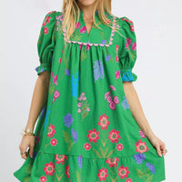 Green floral V-neck dress with puff sleeves and tiered skirt